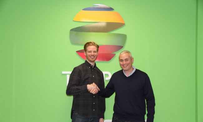 Michael Carey and Karim Sam shaking hands