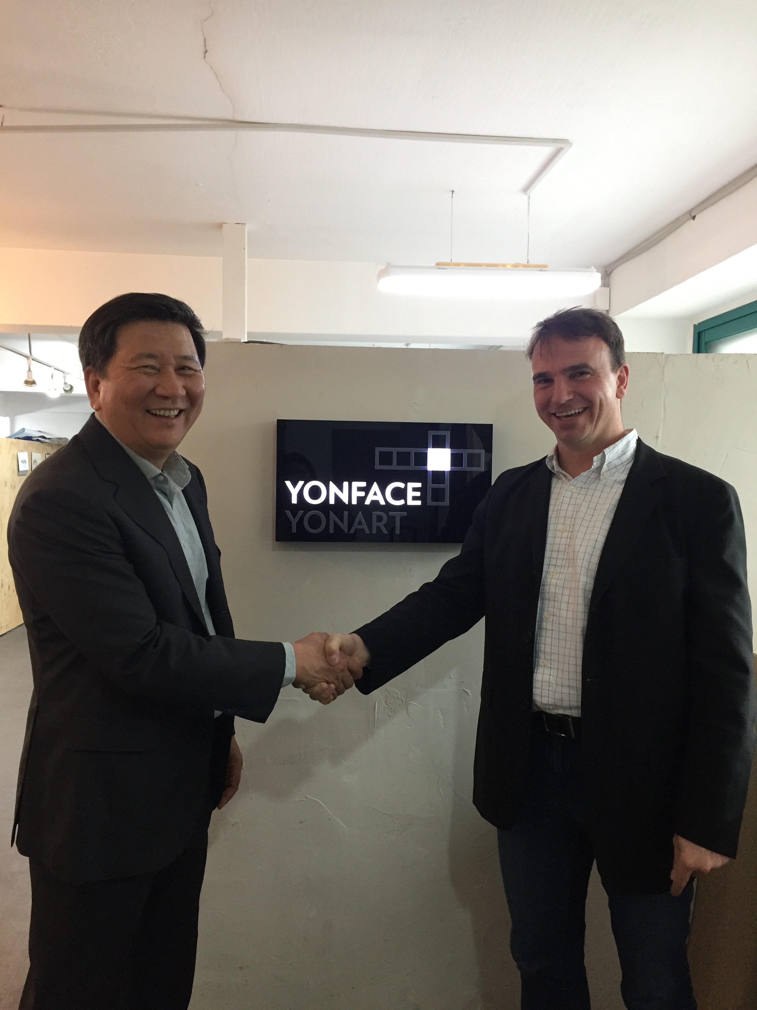 KS Kim, Steffen Haaga shaking hands at YonFace