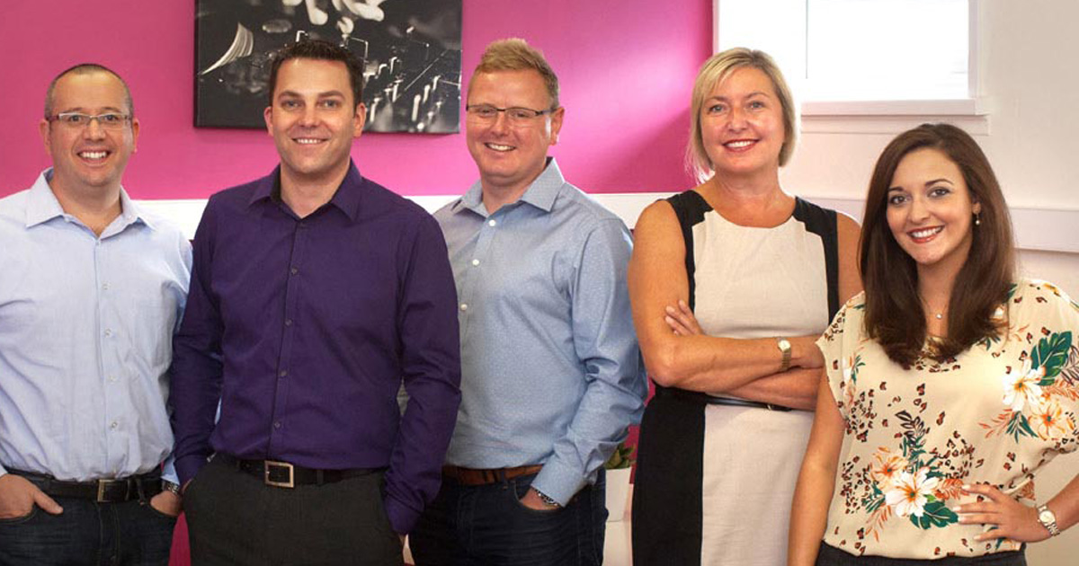 Taopix directors in front of pink wall